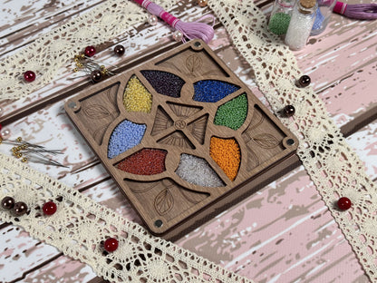 a picture of a wooden box with beads in it
