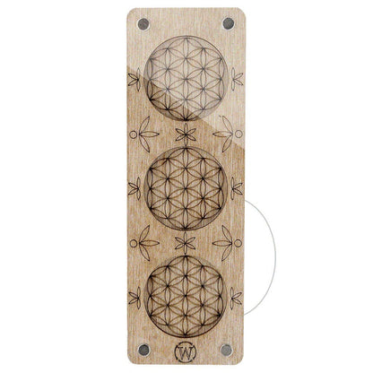 a wooden bookmark with three flower of life designs
