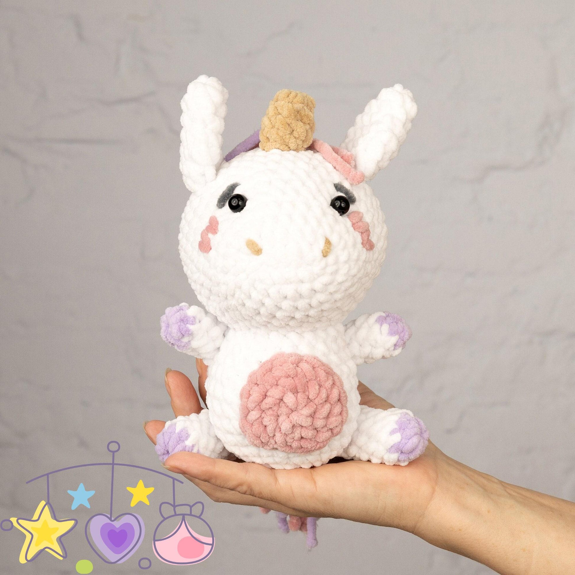 a crocheted stuffed animal sitting next to a ball of yarn