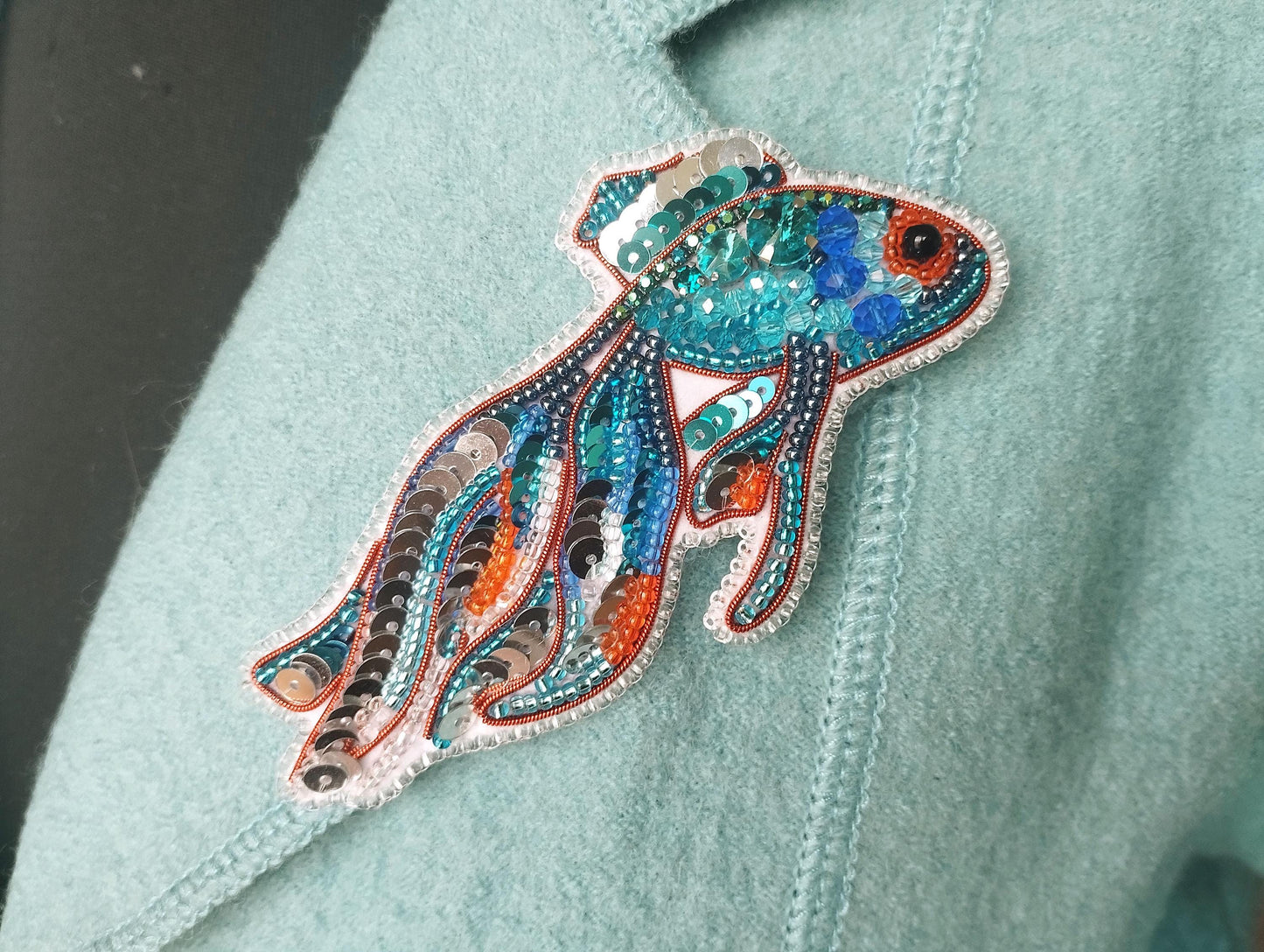 a close up of a person wearing a blue shirt