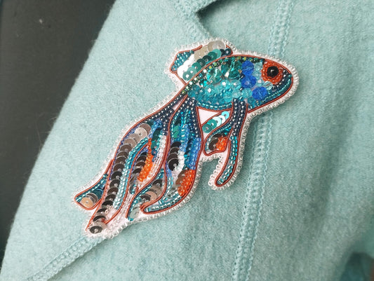 a close up of a person wearing a blue shirt