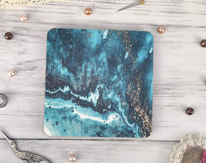 a square coaster with a blue and white marble design