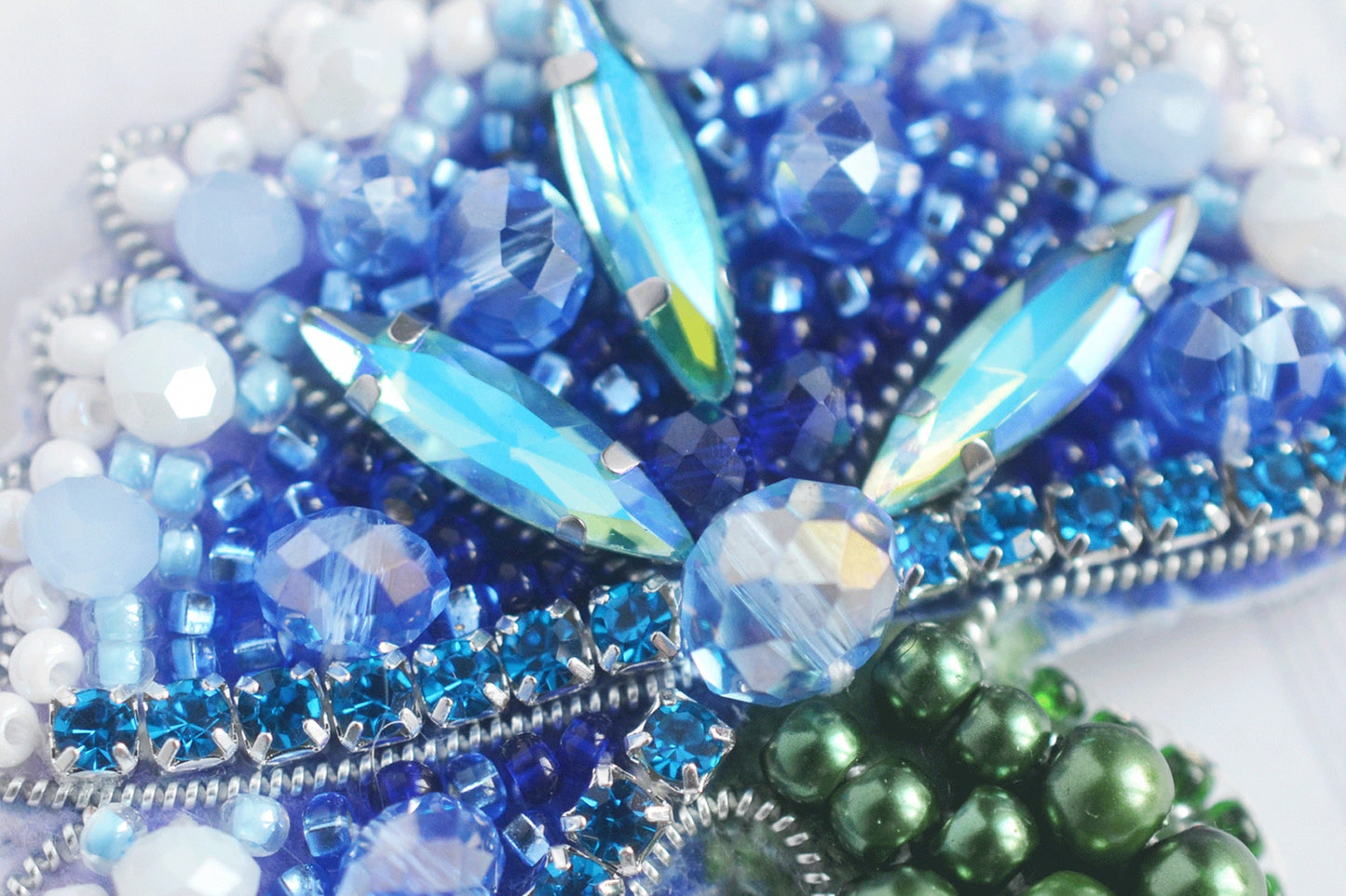 a close up of beads and beads on a white surface