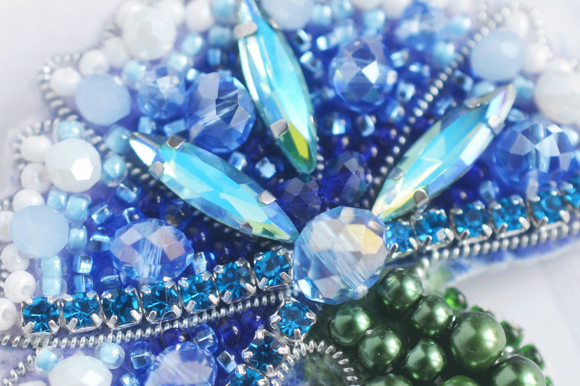 a close up of beads and beads on a white surface