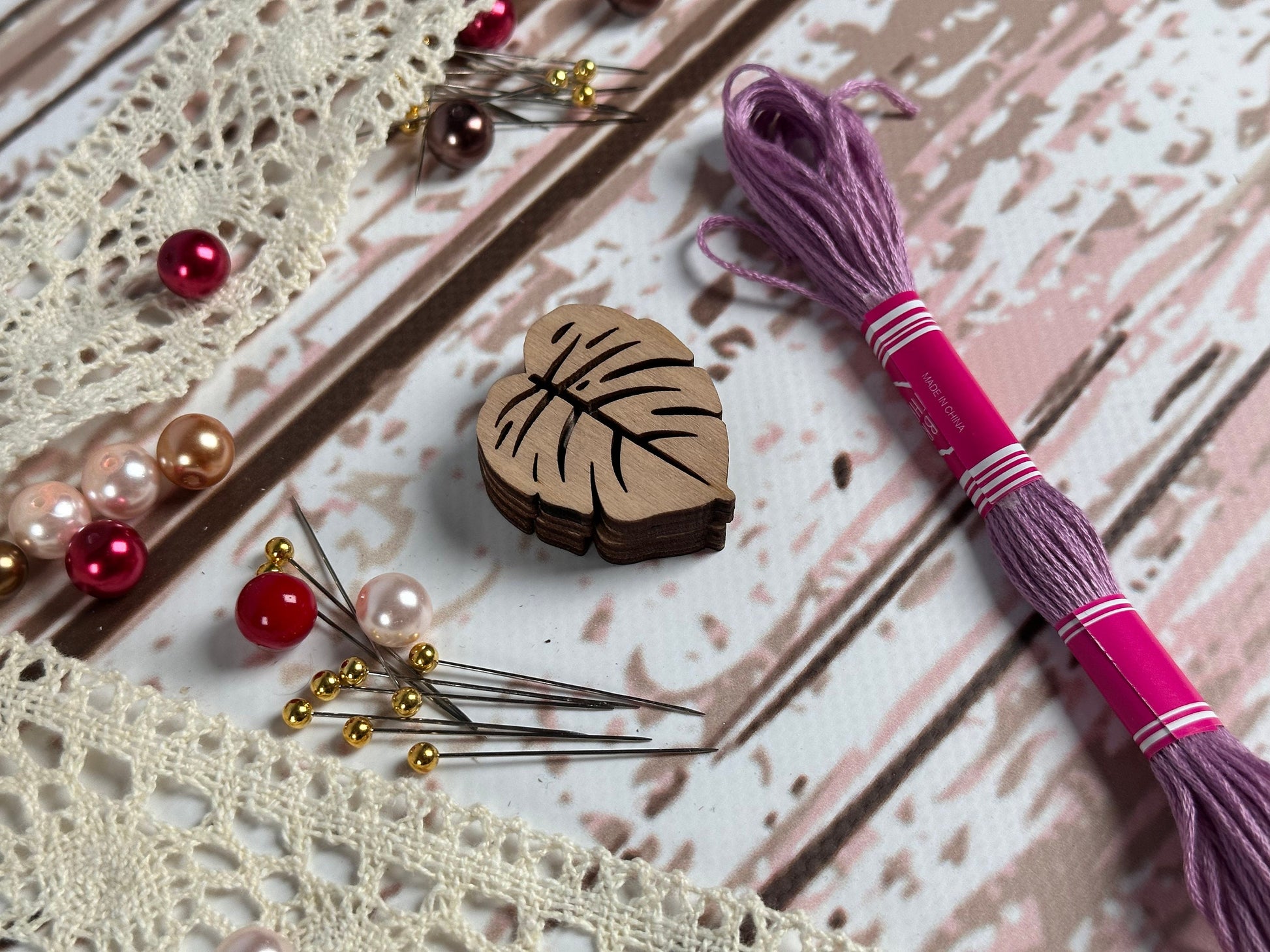 a table topped with lots of crafting supplies