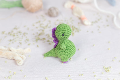 a small crocheted toy sitting on top of a table