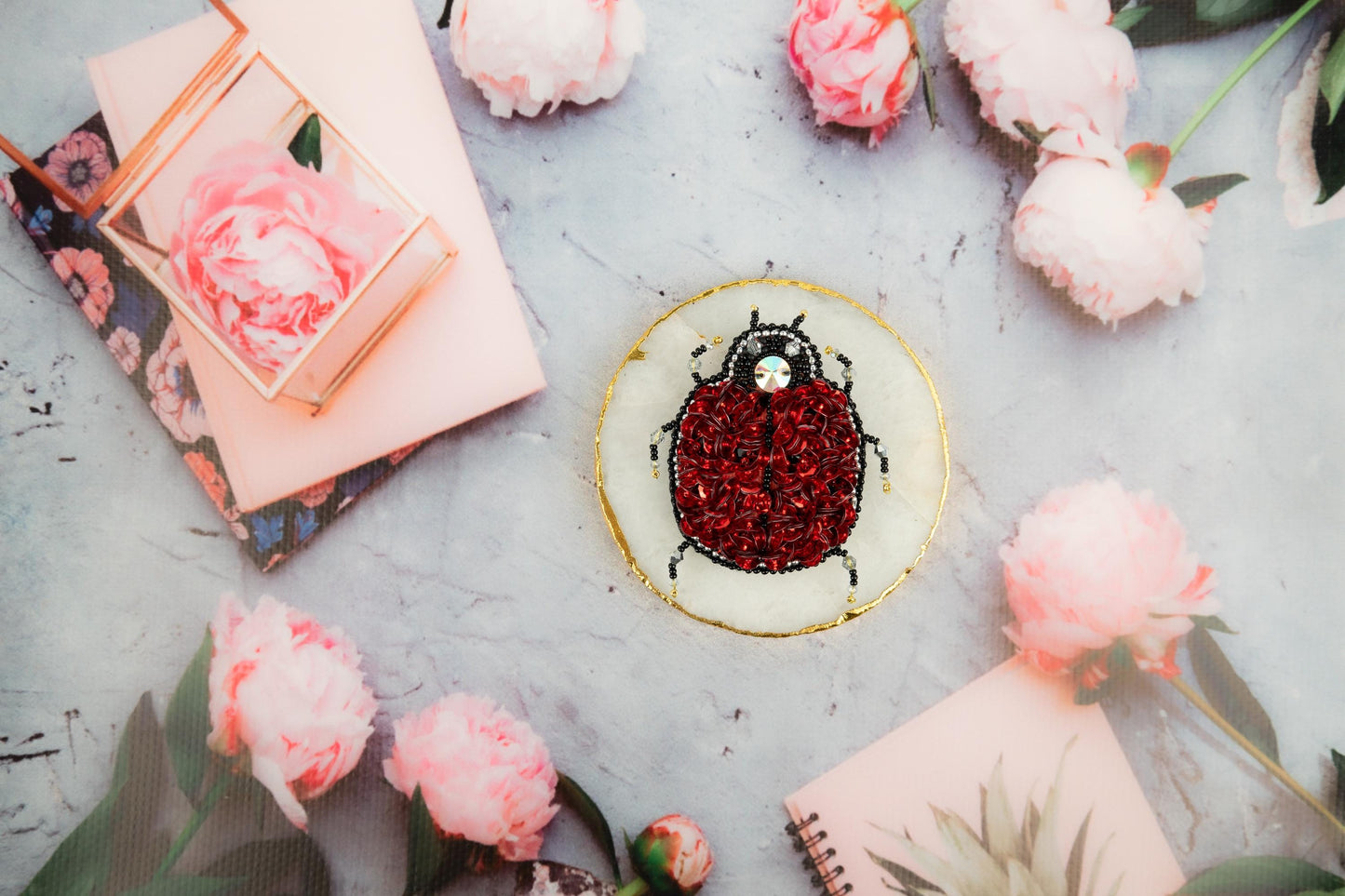 a cake decorated with a lady bug on top of a table