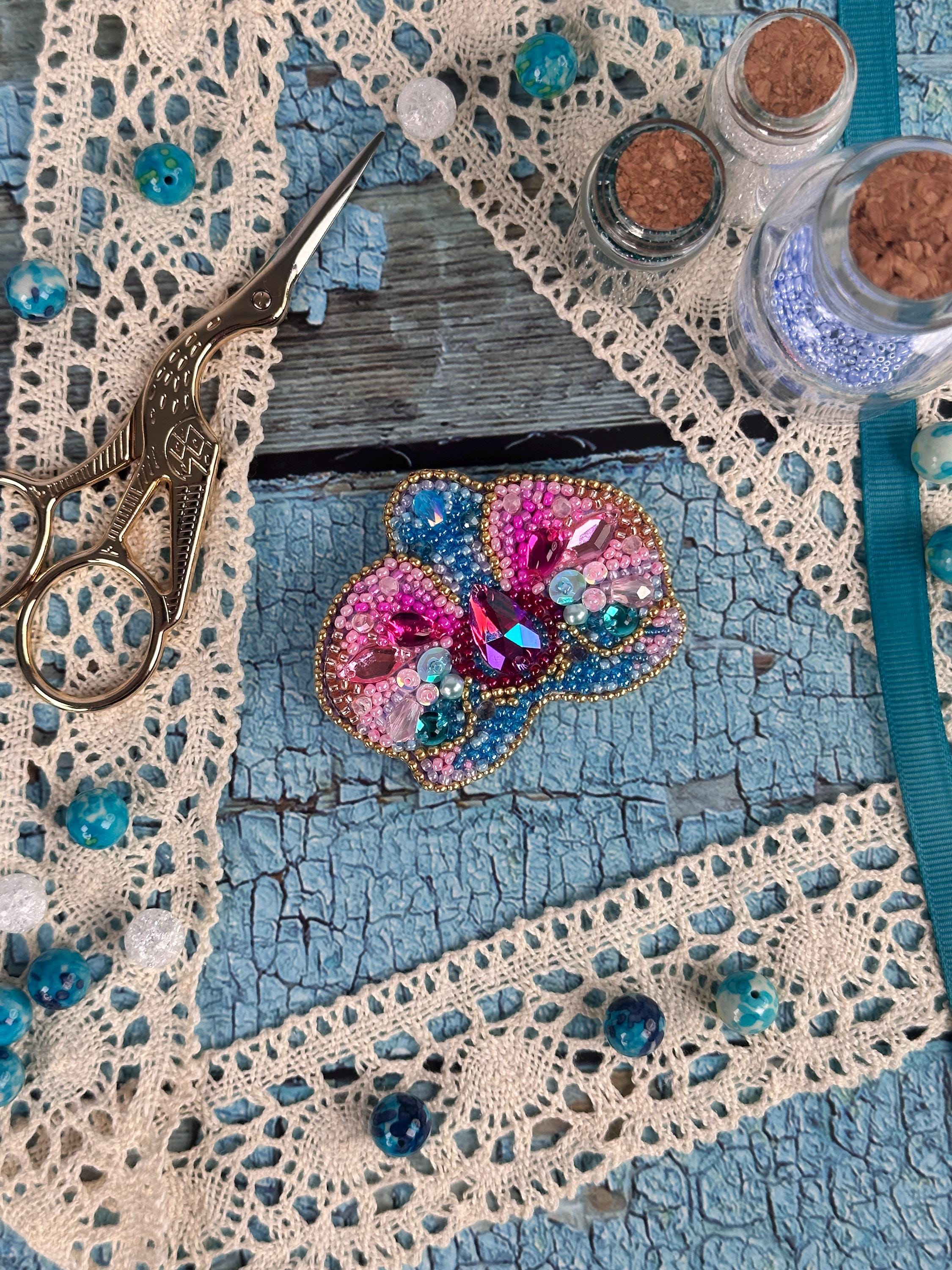 a pair of scissors sitting on top of a table