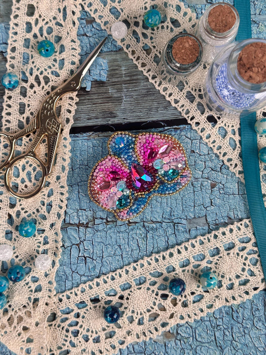 a pair of scissors sitting on top of a table