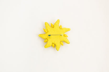 a yellow clock with a yellow face on a white surface