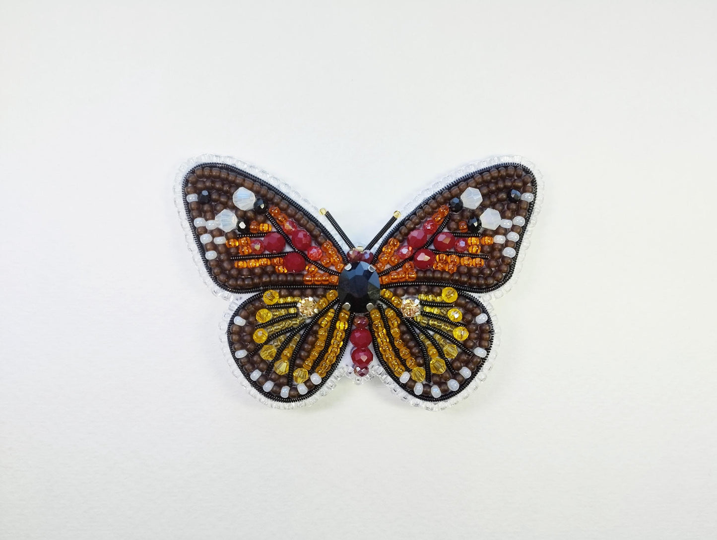 a close up of a butterfly on a white surface