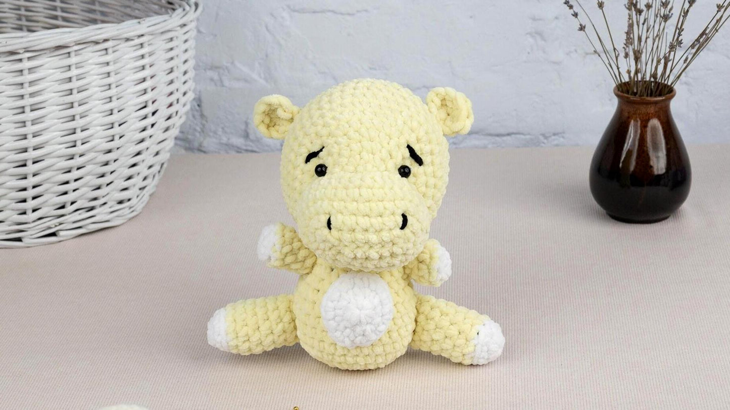 a crocheted stuffed animal sitting on a table