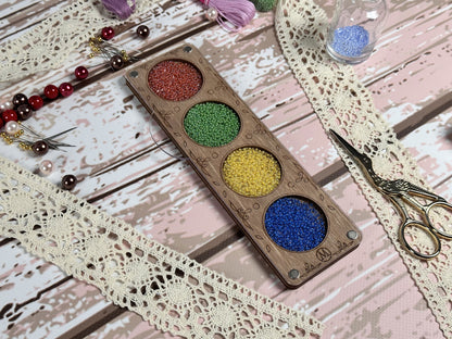 a close up of a paint palette and a pair of scissors