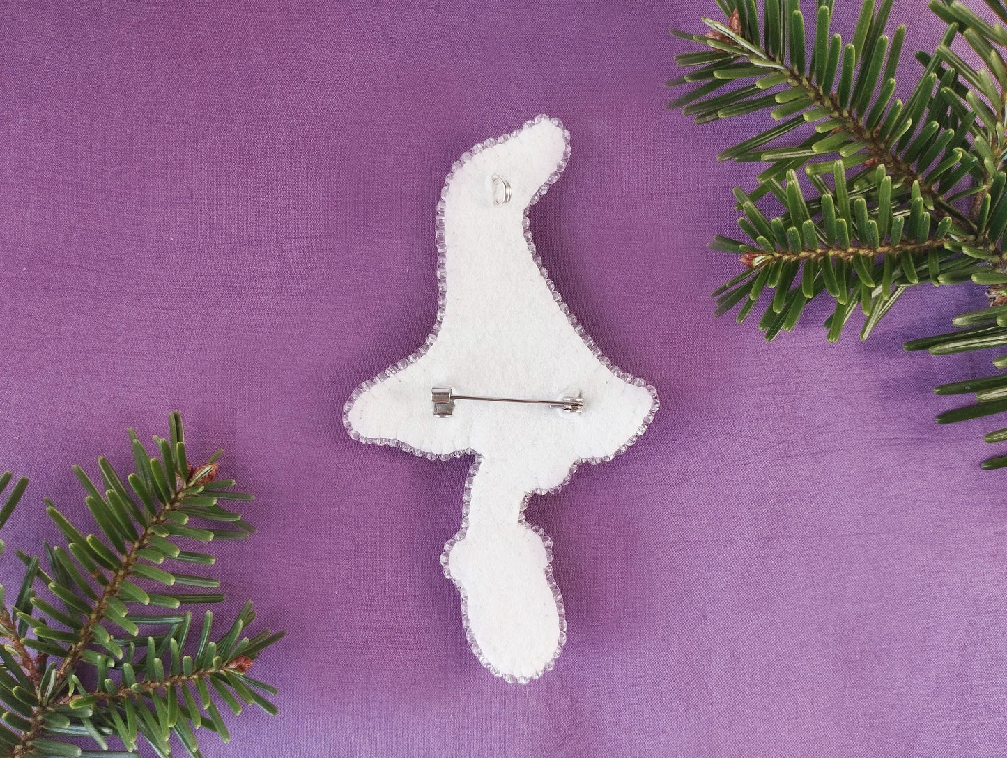 a white clock sitting on top of a purple surface