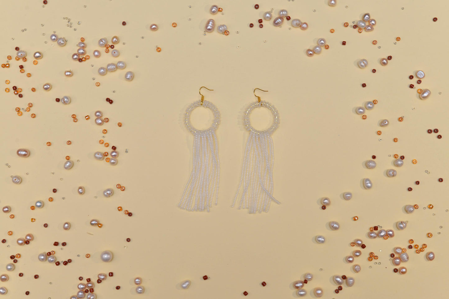 a pair of earrings sitting on top of a table