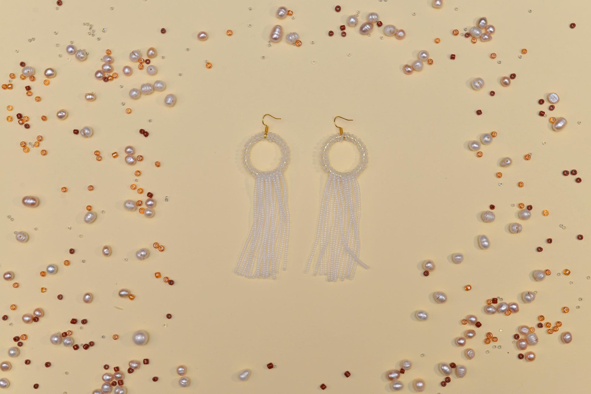 a pair of earrings sitting on top of a table
