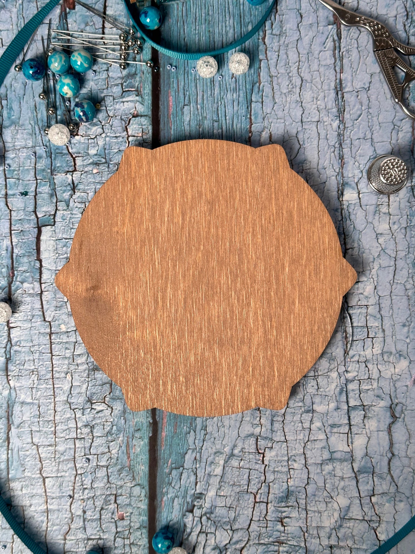 a wooden sign sitting on top of a wooden table