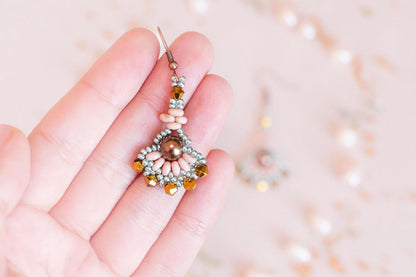 a pair of blue and black beaded earrings