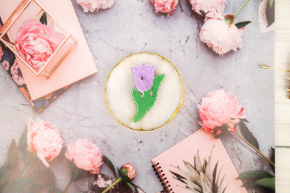 a table topped with pink flowers and a cake