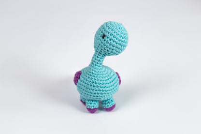 a crocheted toy of a small blue dinosaur