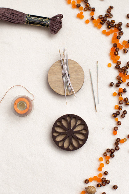 a table topped with different types of crafting supplies