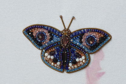 a close up of a butterfly on a white surface