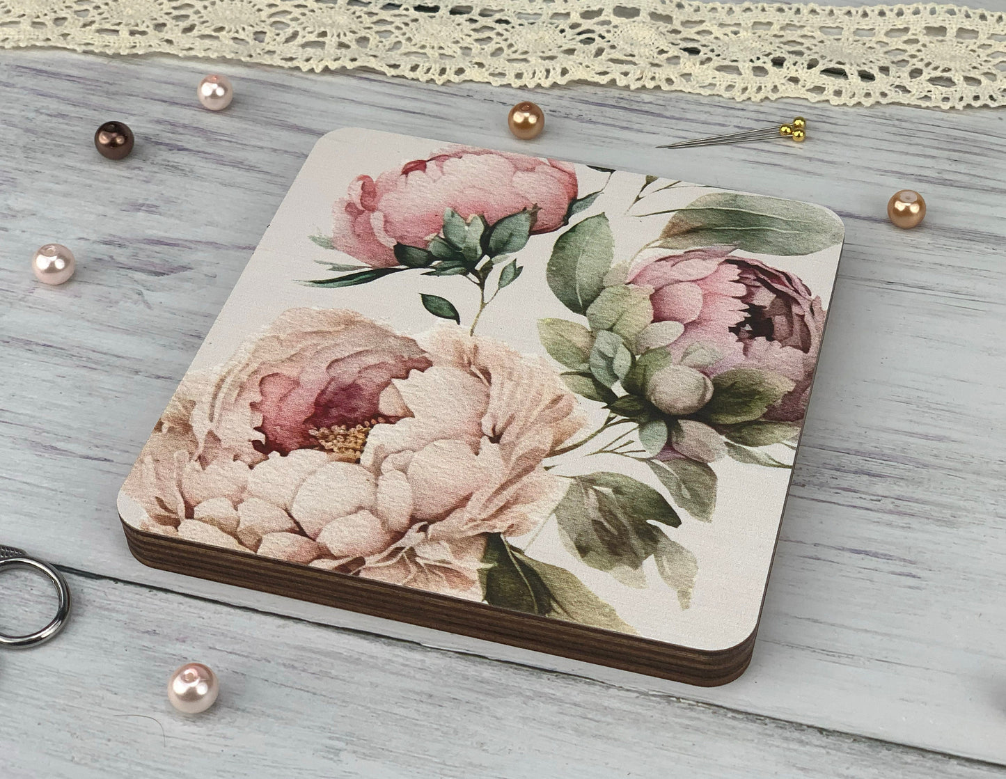 a small notebook with a flower design on it