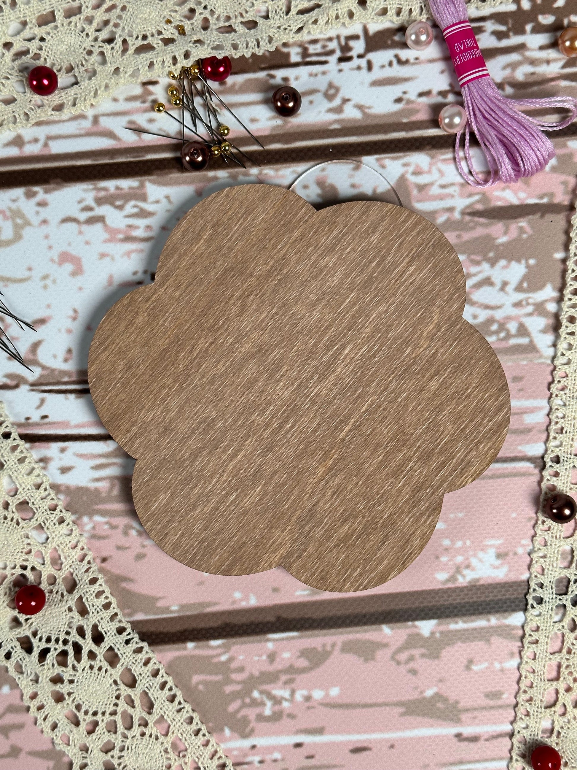 a picture of a piece of wood on a piece of lace