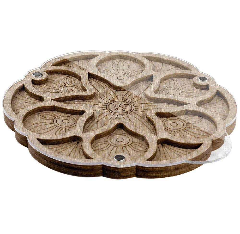 a set of four wooden coasters sitting on top of each other