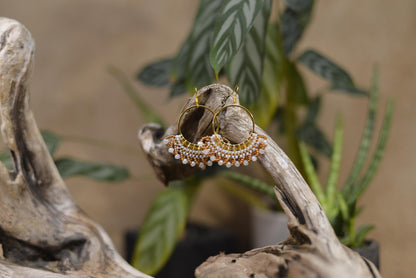 a couple of rings sitting on top of a piece of wood