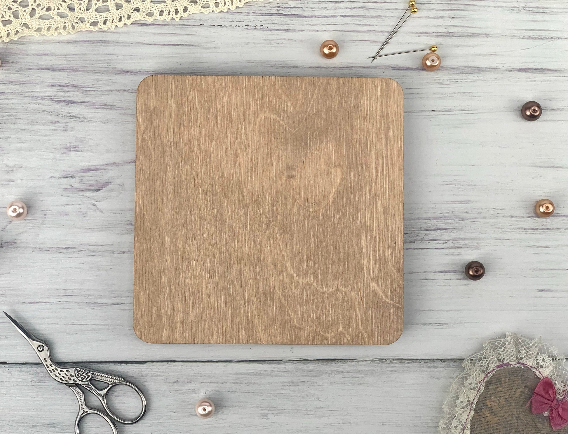 a wooden cutting board sitting on top of a table