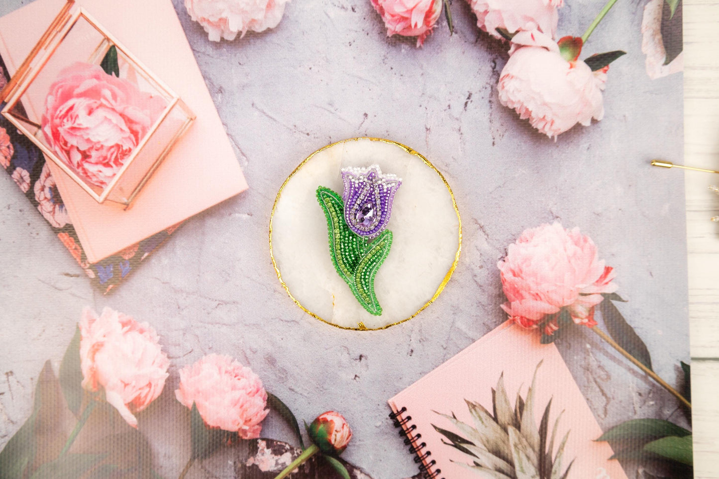 a cake decorated with a flower on top of a table