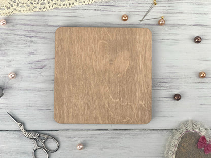 a wooden cutting board sitting on top of a table