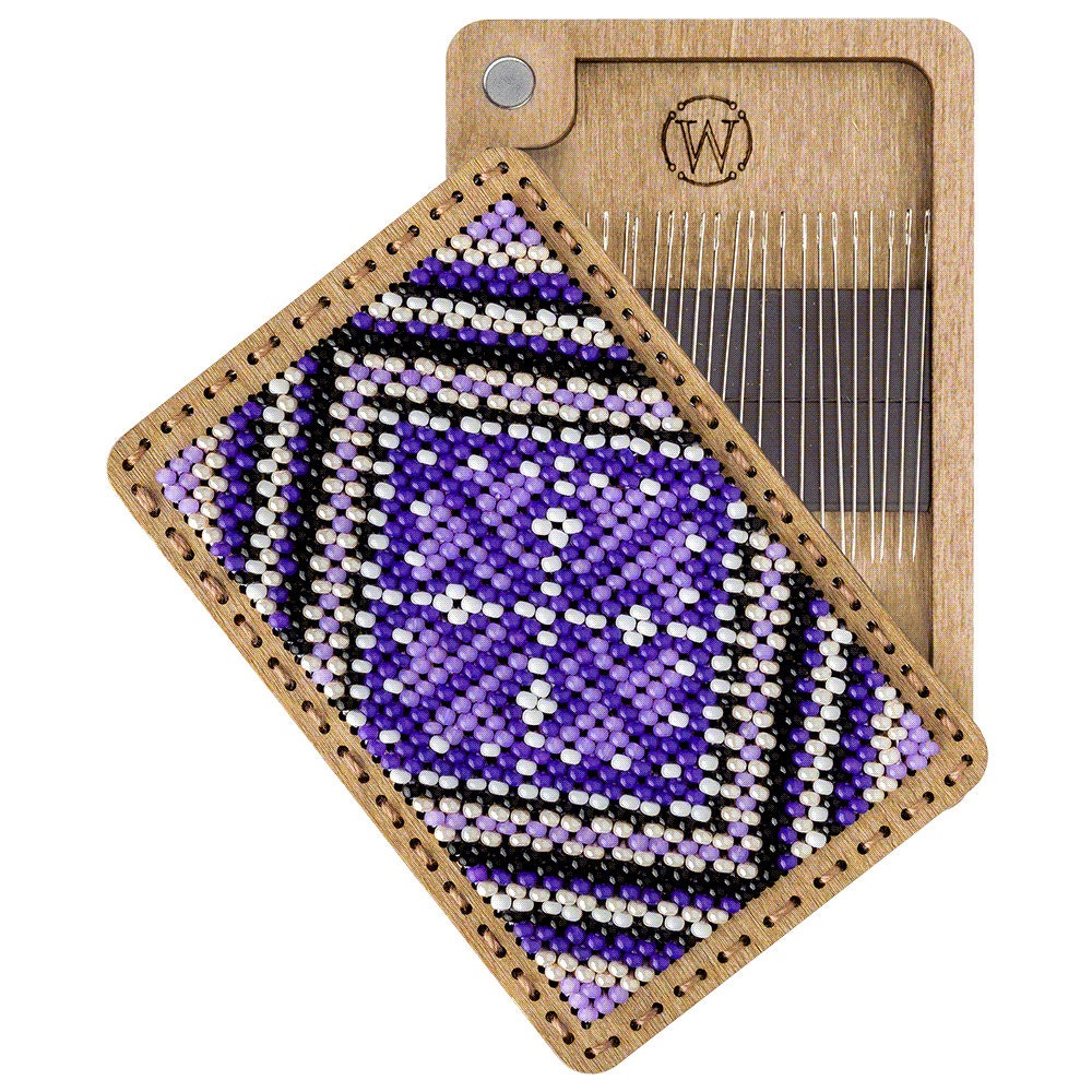 a wooden tray with a purple and black design on it