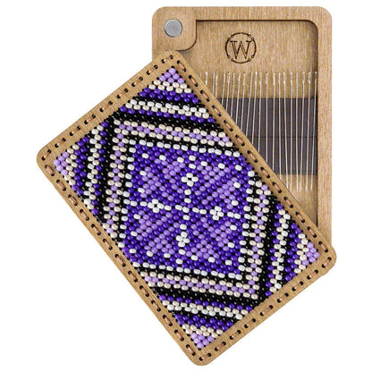 a wooden tray with a purple and black design on it