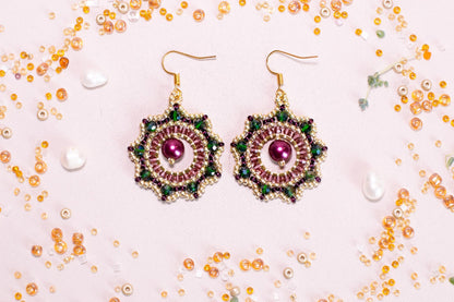 a pair of earrings sitting on top of a table