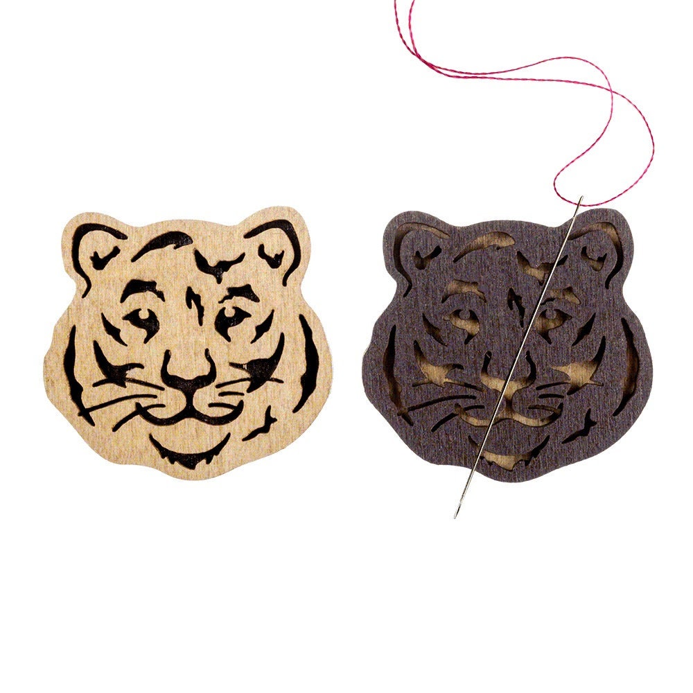 a tiger and a tiger head cut out of wood