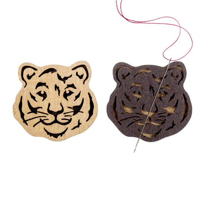 a tiger and a tiger head cut out of wood