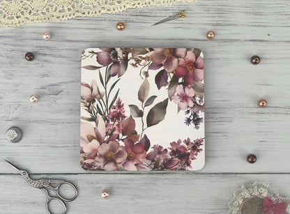 a white wooden table topped with a pair of scissors