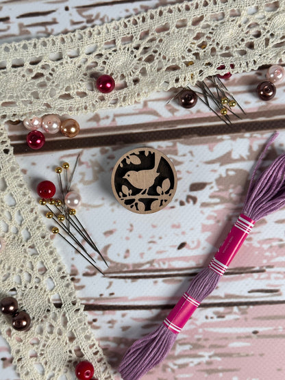 a close up of a piece of art with beads