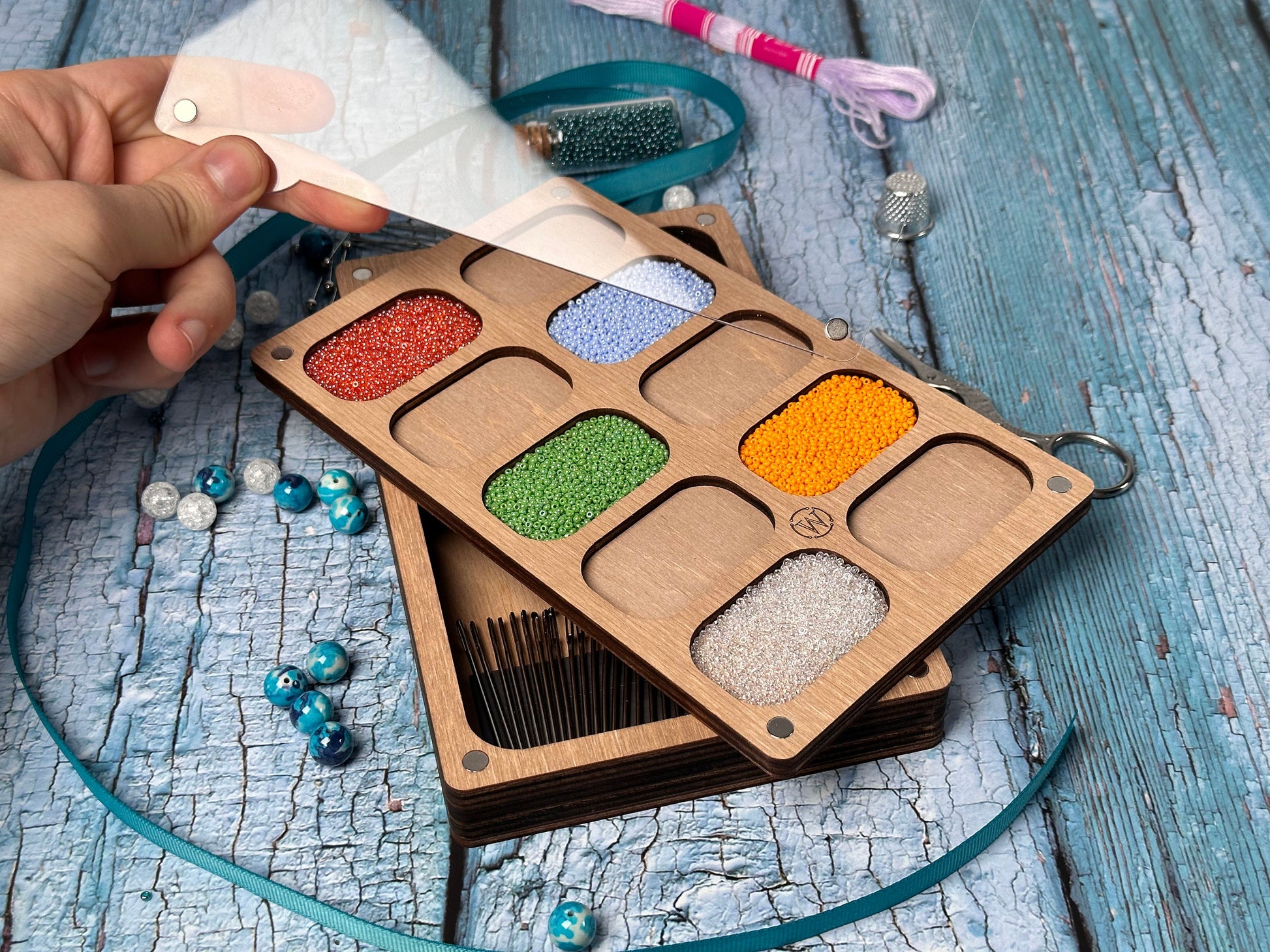 a person is holding a palette of different colors