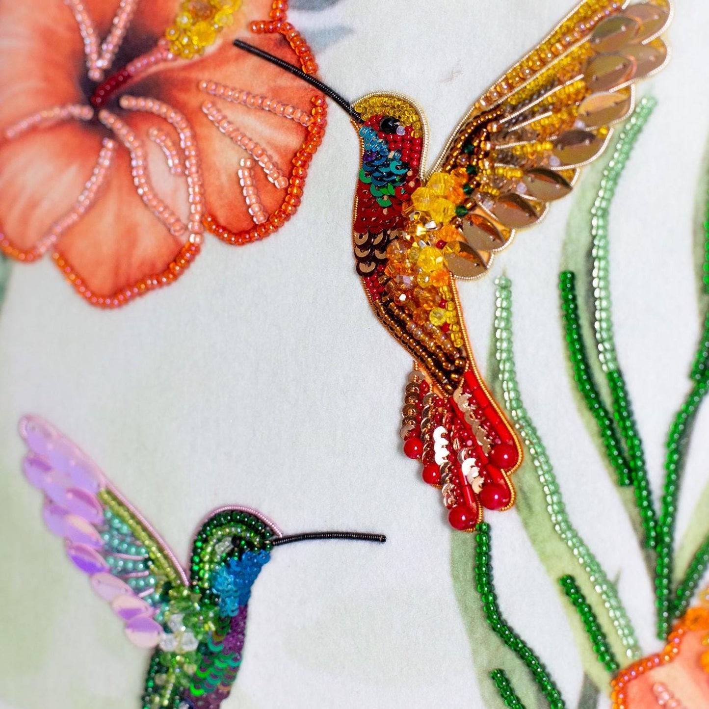 a picture of a picture of a hummingbird and flowers