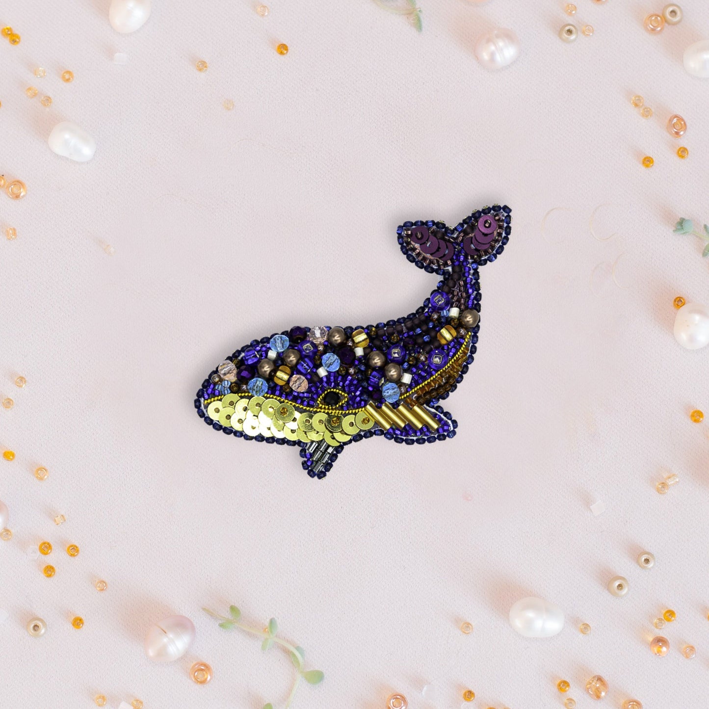 a picture of a whale made of beads