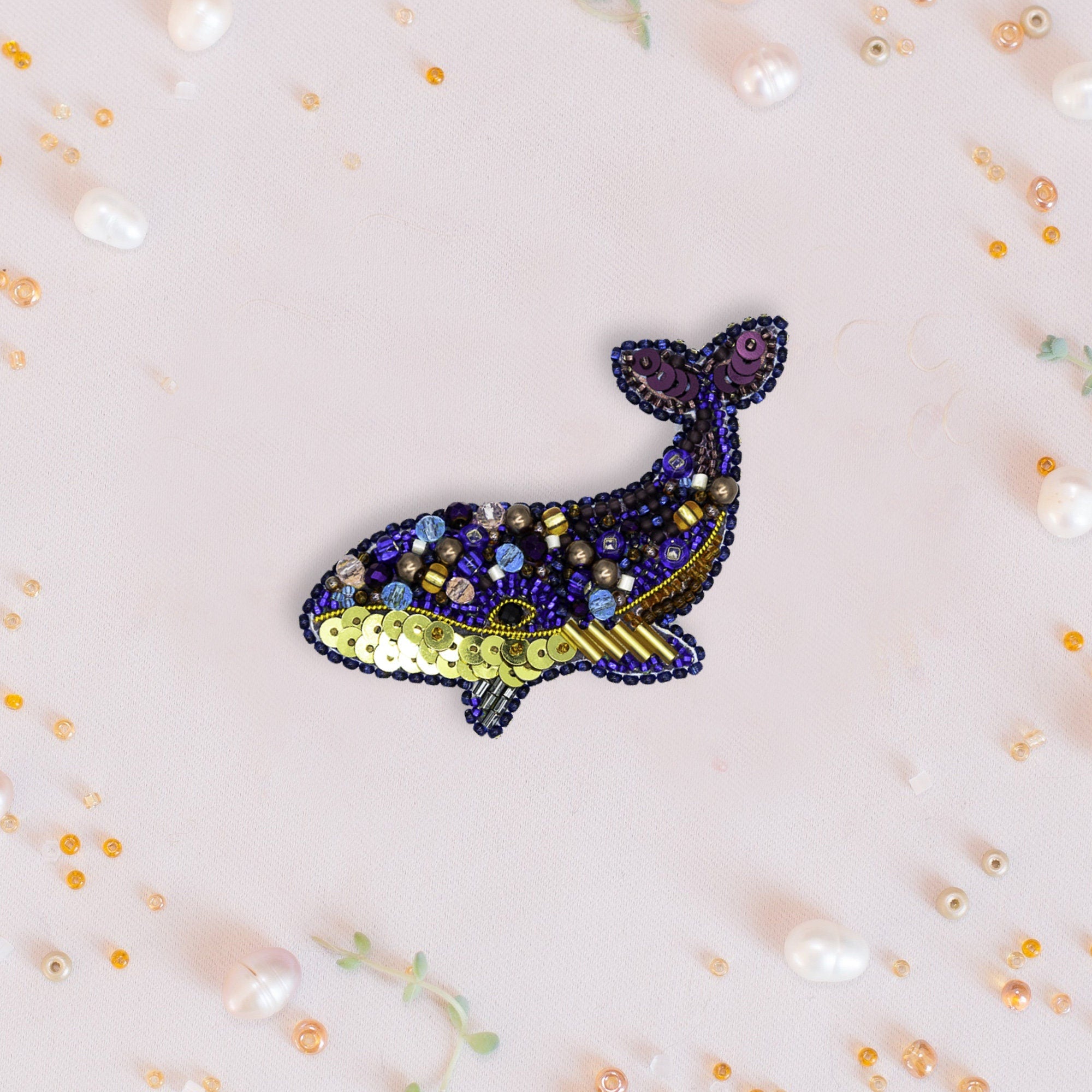 a picture of a whale made of beads