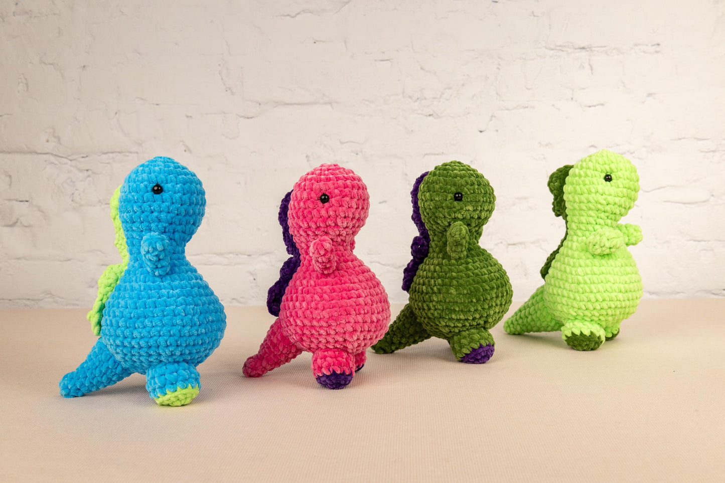 a group of crocheted toy animals sitting next to each other
