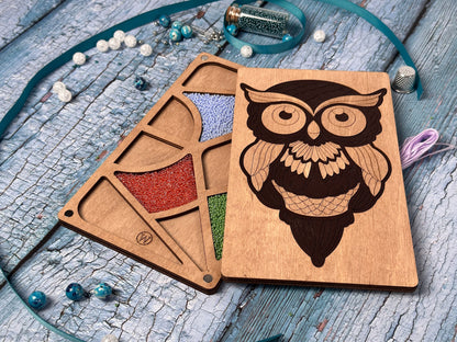 two wooden coasters with an owl design on them
