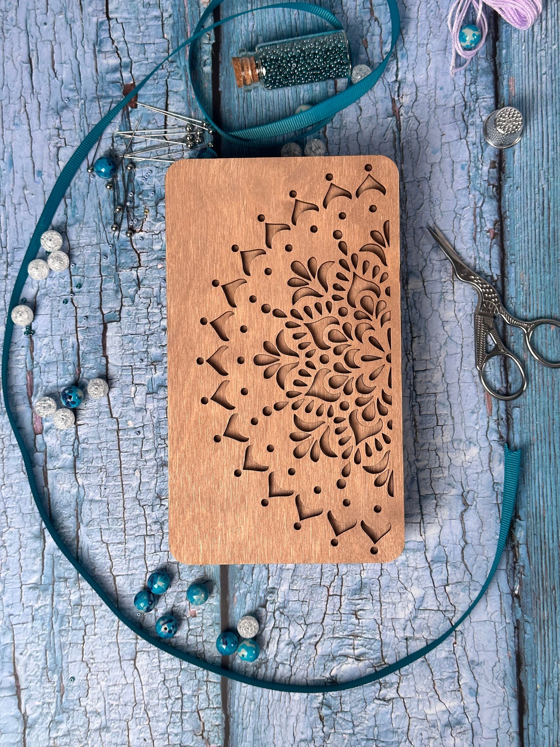 a wooden cutting board with a design on it