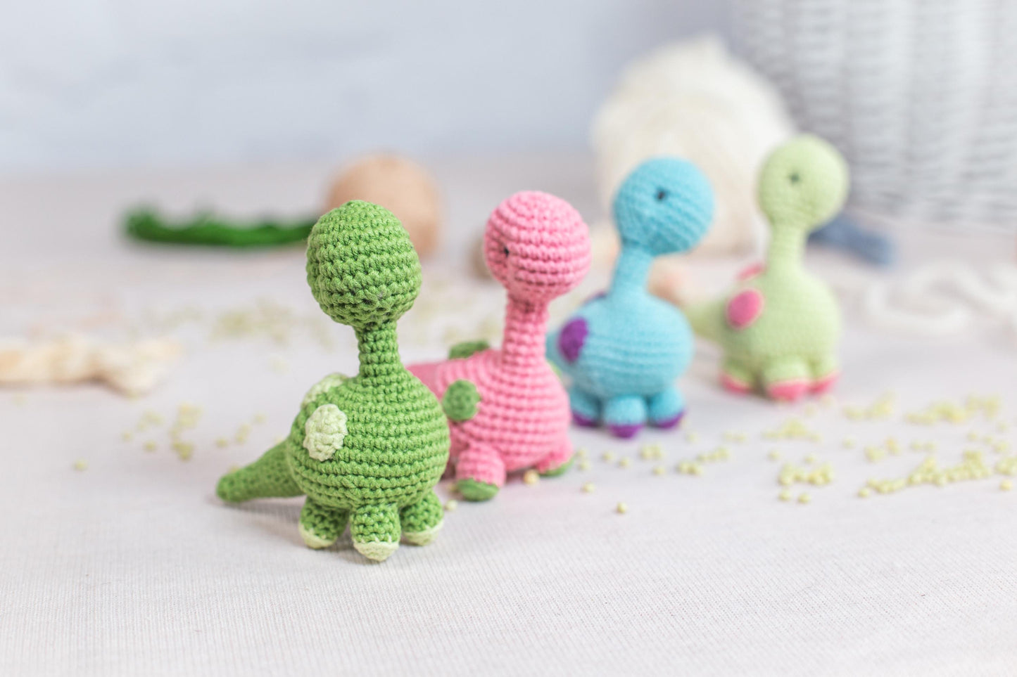 a group of crocheted toys sitting on top of a table