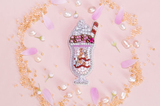 a bottle filled with lots of different types of beads