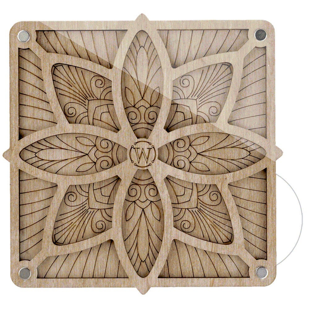 a wooden block with a flower design on it